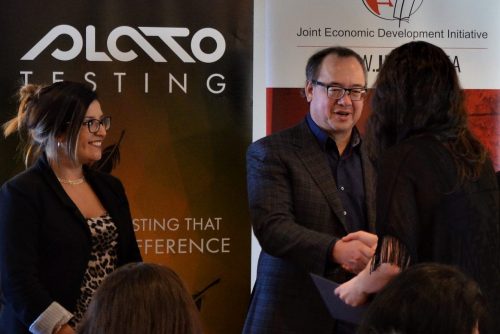 CEO Keith McIntosh Shaking Hands with a PLATO Testing Training Program Graduate