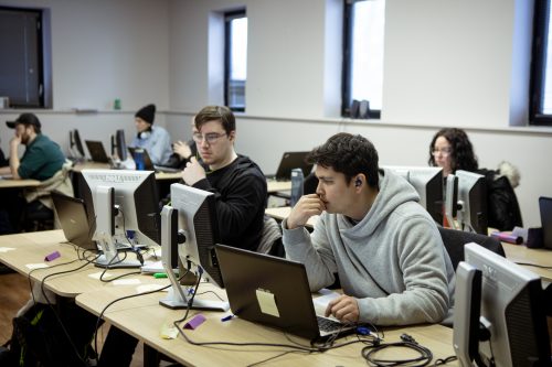 PLATO Testing training students working on laptops