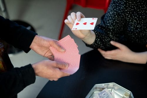 Employees from PQA play Chase the Ace