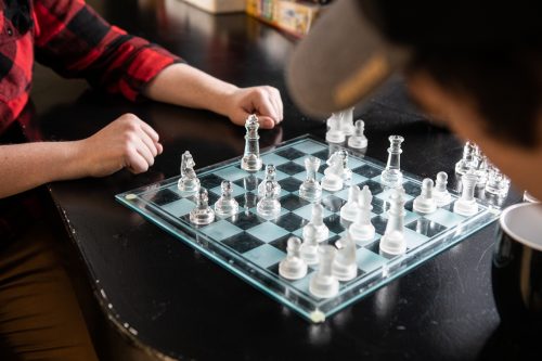 Employees from PQA play chess