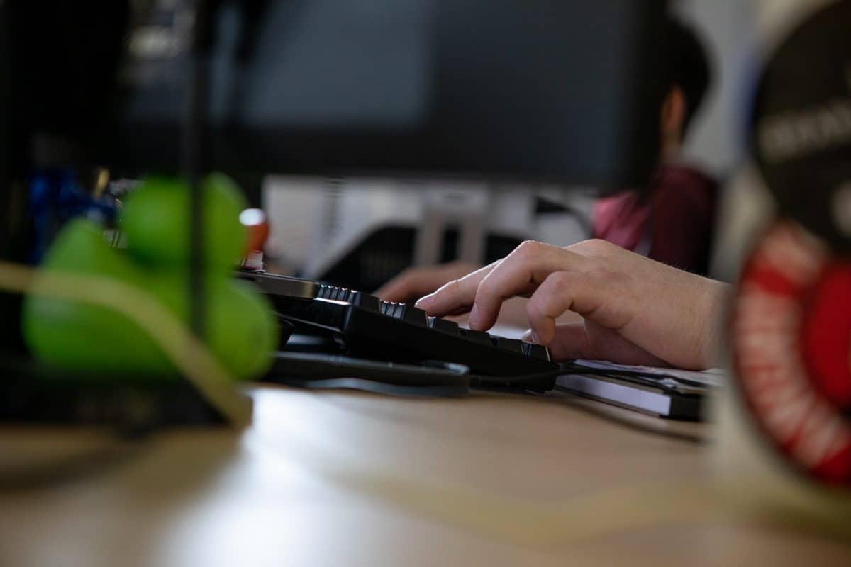 Employee Typing on Keyboard