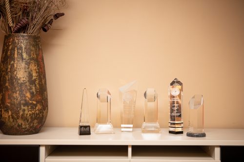 Glass awards won by PQA sitting on a shelf